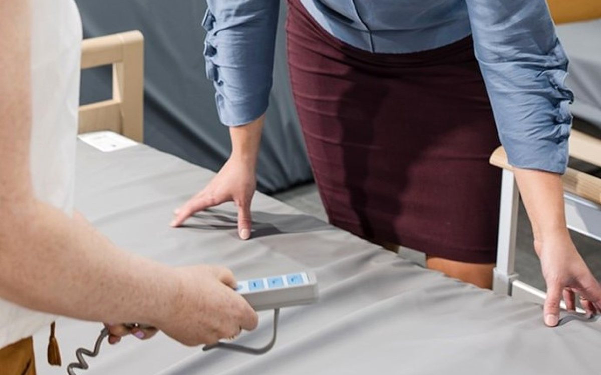 Adjusting a bed control at home
