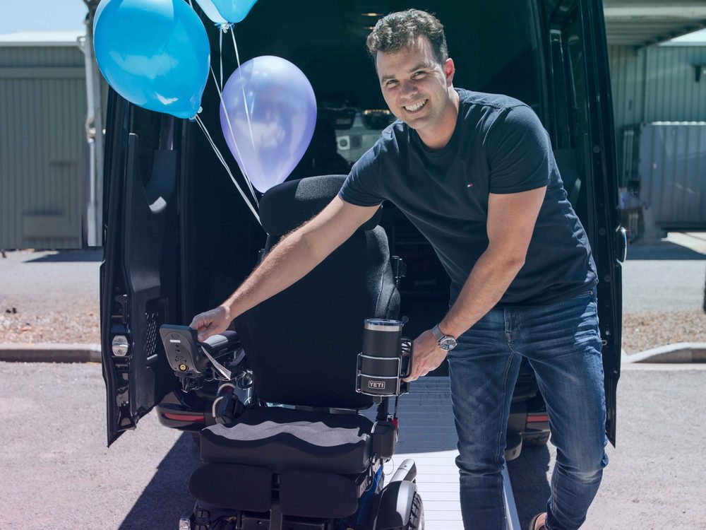 Regency Care team member delivering a power wheelchair