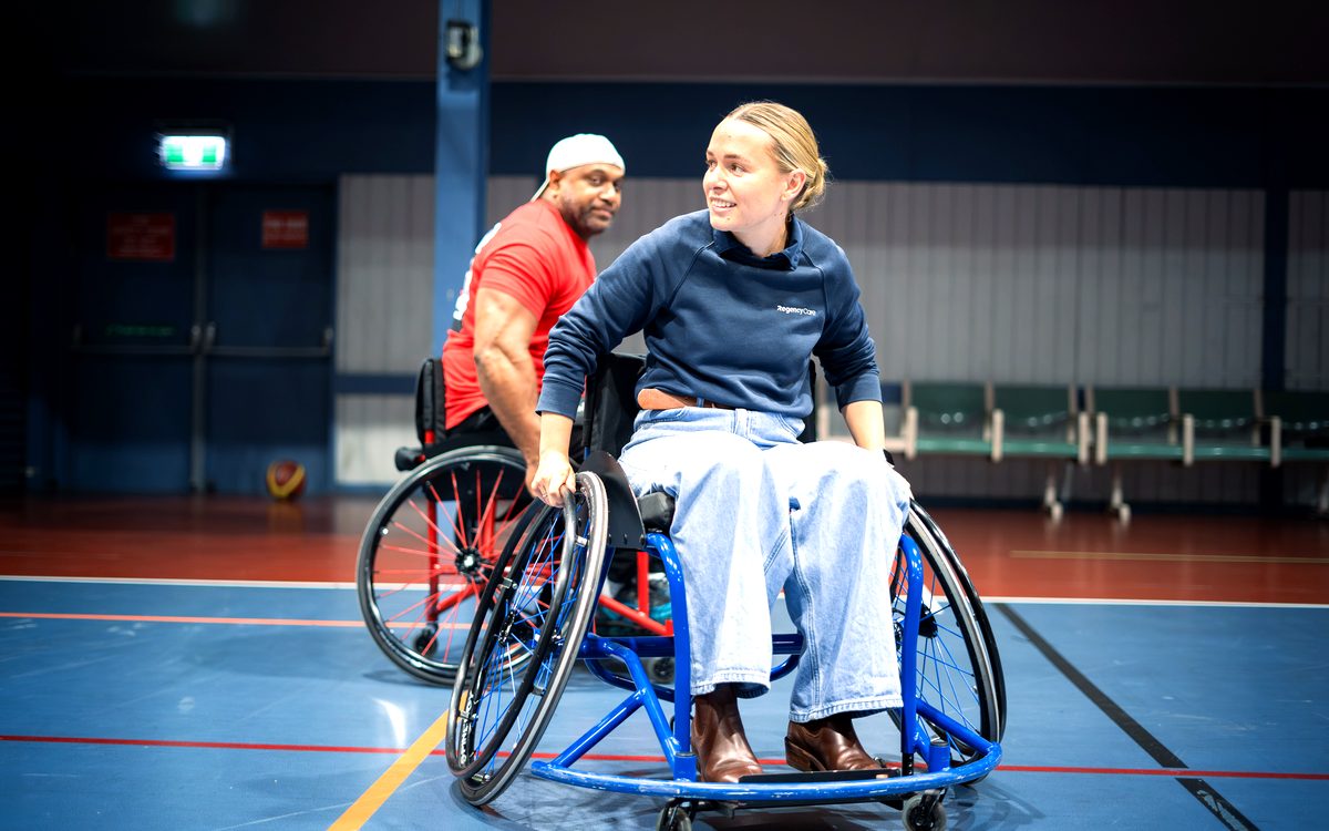 Wilson playing basketball in his manual wheelchair